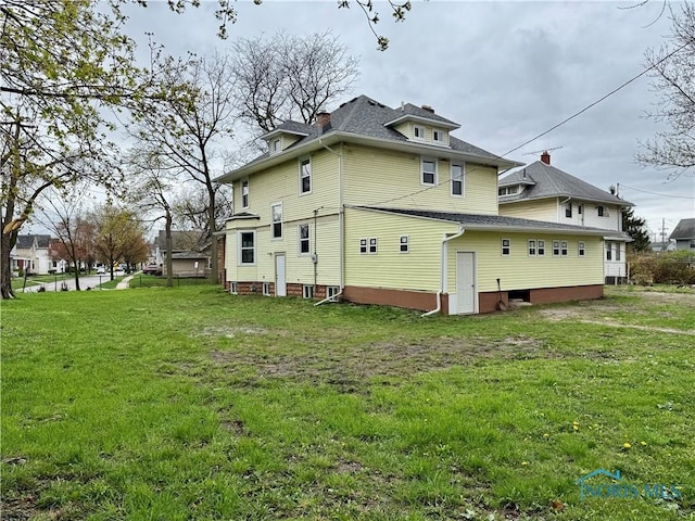 exterior space with a yard