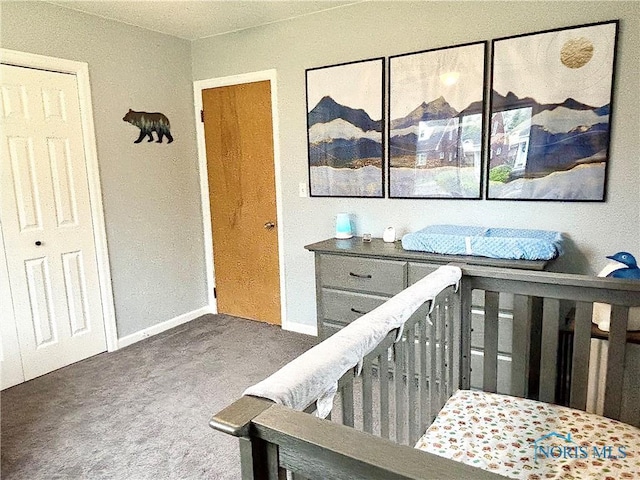 bedroom with carpet and baseboards