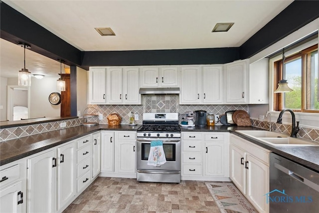 24203 W Reservation Line Rd, Curtice, OH 43412 - kitchen featuring a sink, dark countertops, stainless steel appliances, and under cabinet range hood