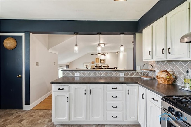 24203 W Reservation Line Rd, Curtice, OH 43412 - kitchen with a peninsula, dark countertops, baseboards, and tasteful backsplash