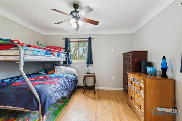 24203 W Reservation Line Rd, Curtice, OH 43412 - bedroom featuring baseboards, ceiling fan, and hardwood / wood-style floors