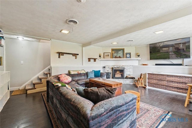 24203 W Reservation Line Rd, Curtice, OH 43412 - living area featuring visible vents, ornamental molding, wood finished floors, a fireplace, and stairway