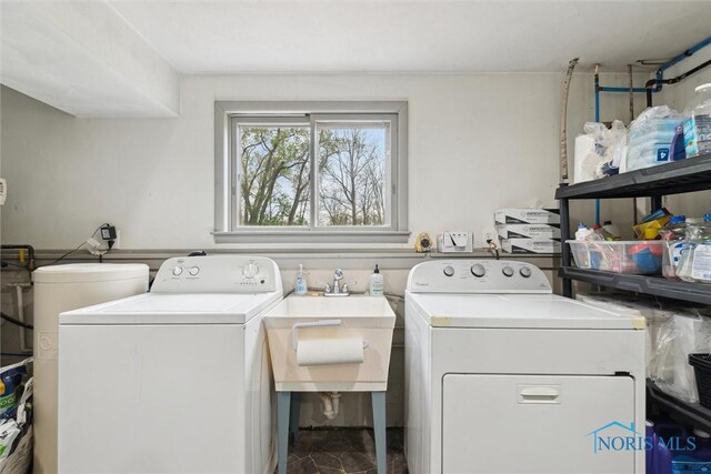 24203 W Reservation Line Rd, Curtice, OH 43412 - clothes washing area featuring laundry area, a sink, and independent washer and dryer