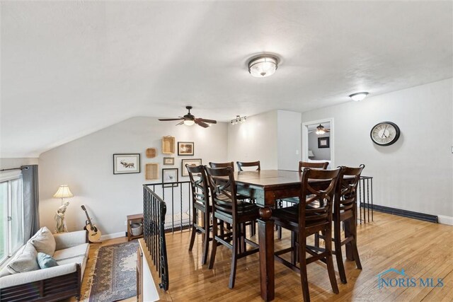 24203 W Reservation Line Rd, Curtice, OH 43412 - dining room with ceiling fan, baseboards, and light wood finished floors