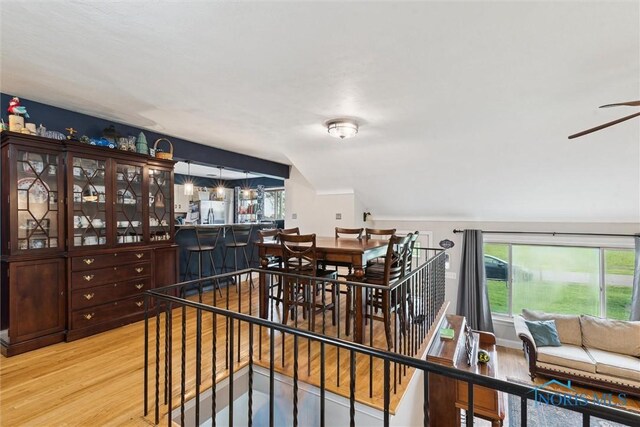 24203 W Reservation Line Rd, Curtice, OH 43412 - dining space with light wood-style floors and a ceiling fan
