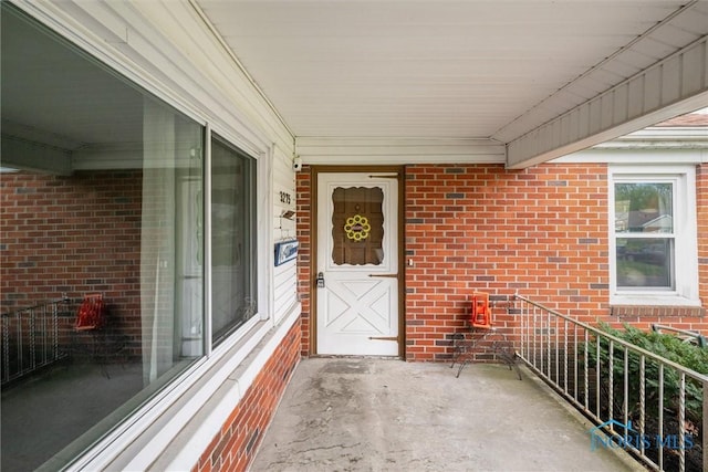 entrance to property with brick siding