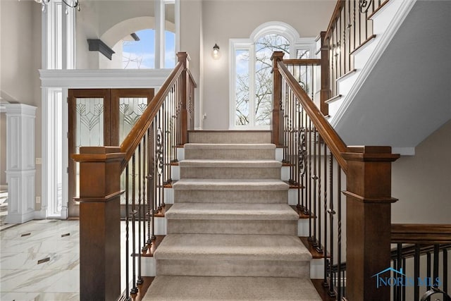 10915 Reed Rd, Monclova, OH 43542 - stairway featuring a towering ceiling, marble finish floor, and plenty of natural light