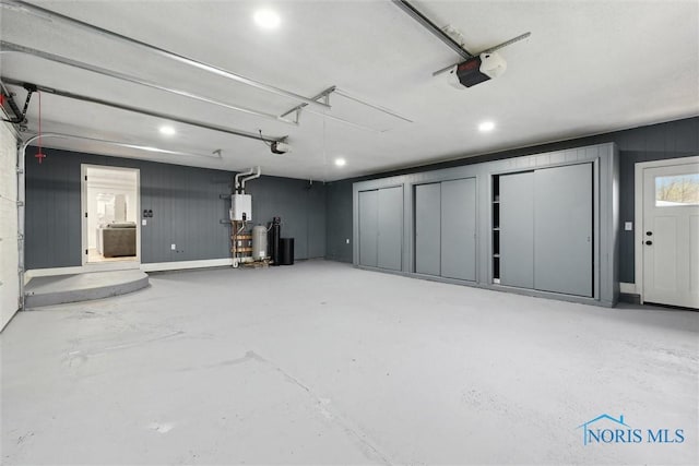 garage featuring recessed lighting and a garage door opener