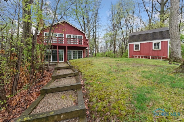 19788 Otsego Pike, Bowling Green, OH 43402 - view of yard featuring a storage shed, a deck, and an outbuilding