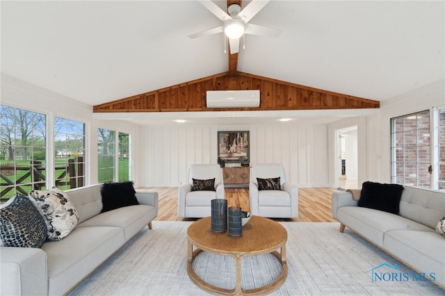 19788 Otsego Pike, Bowling Green, OH 43402 - living room with light wood-type flooring, lofted ceiling with beams, a ceiling fan, and a wall mounted AC
