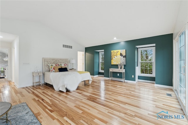 19788 Otsego Pike, Bowling Green, OH 43402 - bedroom with baseboards, visible vents, wood finished floors, and vaulted ceiling