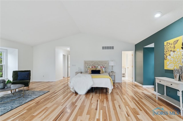 19788 Otsego Pike, Bowling Green, OH 43402 - bedroom featuring baseboards, visible vents, wood finished floors, and vaulted ceiling
