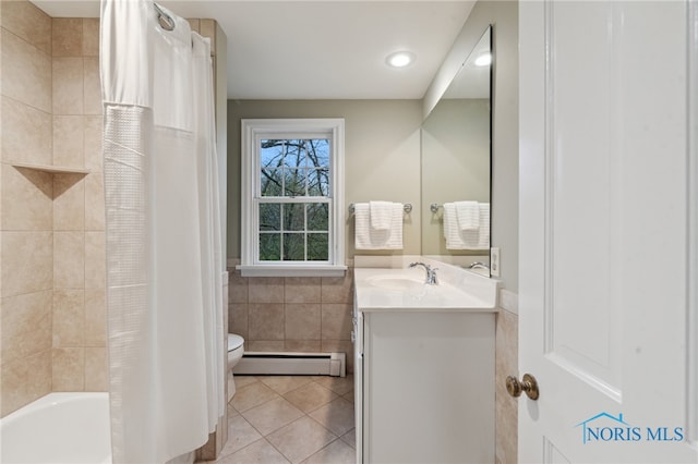 19788 Otsego Pike, Bowling Green, OH 43402 - bathroom featuring tile walls, vanity, toilet, tile patterned flooring, and baseboard heating