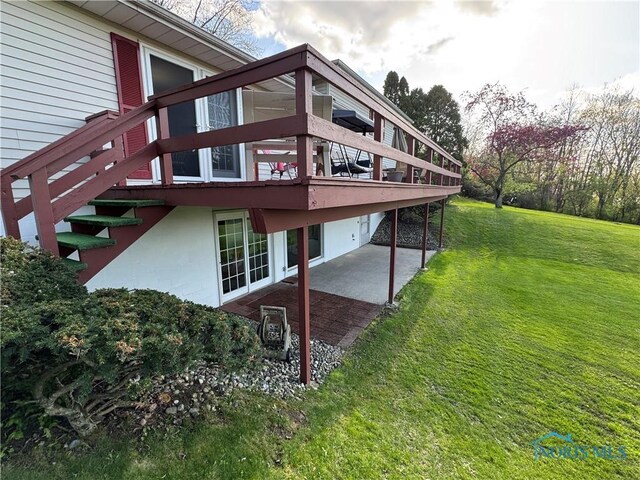 1883 Riverview Dr, Defiance, OH 43512 - exterior space with a lawn, a patio, and a deck