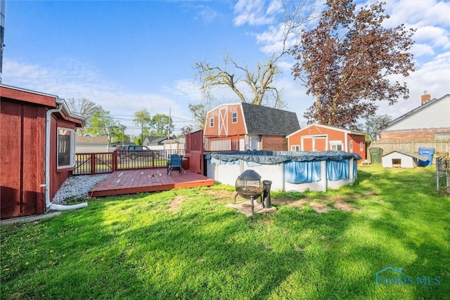 4532 290th St, Toledo, OH 43611 - view of swimming pool featuring a shed, an outdoor structure, and a wooden deck