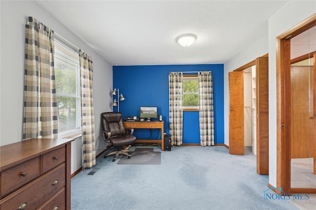 office featuring baseboards and carpet floors