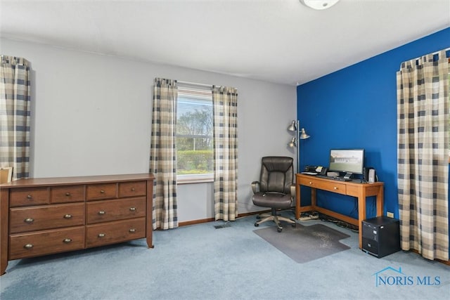 carpeted home office featuring baseboards