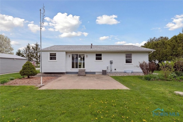rear view of property with a patio, a yard, central AC, and entry steps