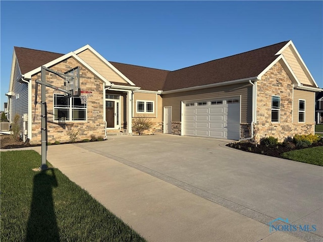 craftsman house featuring a garage, roof with shingles, driveway, and stone siding