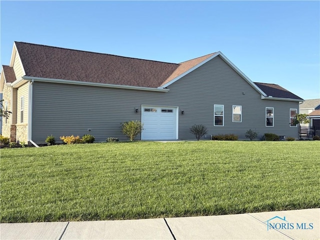 view of home's exterior featuring a lawn, a shingled roof, and an attached garage