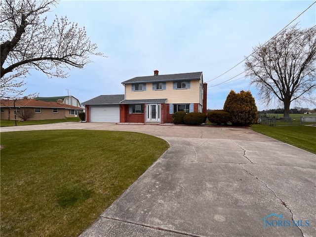 traditional home with a front lawn, a garage, brick siding, driveway, and a chimney