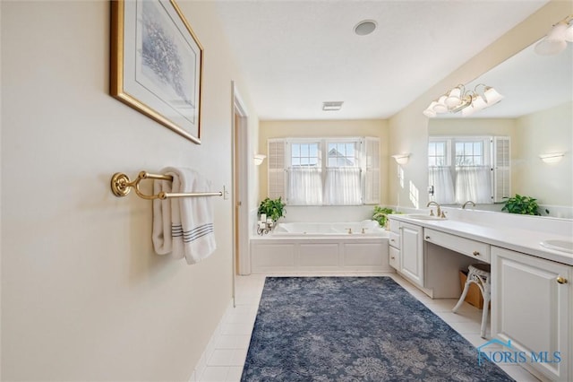 bathroom with double vanity, plenty of natural light, a bath, and tile patterned flooring