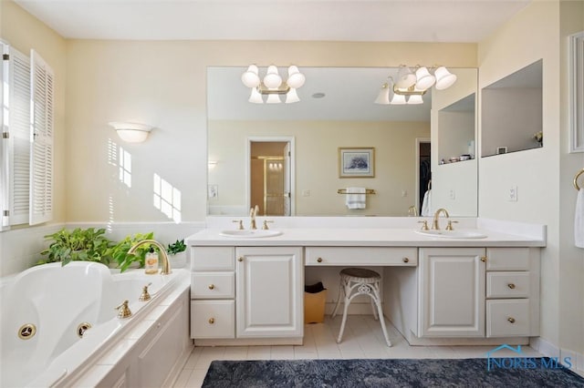 full bath featuring a jetted tub, a sink, double vanity, and tile patterned floors