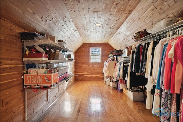 spacious closet featuring wood finished floors and lofted ceiling