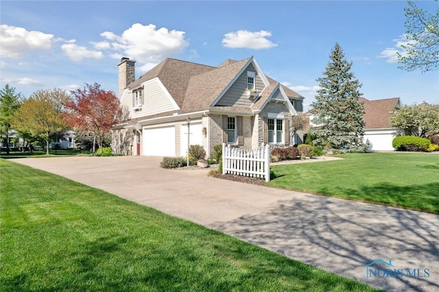 craftsman-style house featuring a chimney, a front yard, concrete driveway, and an attached garage