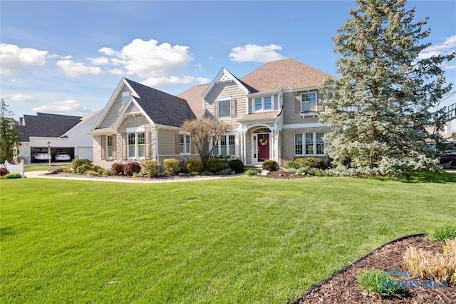view of front of property with a front lawn