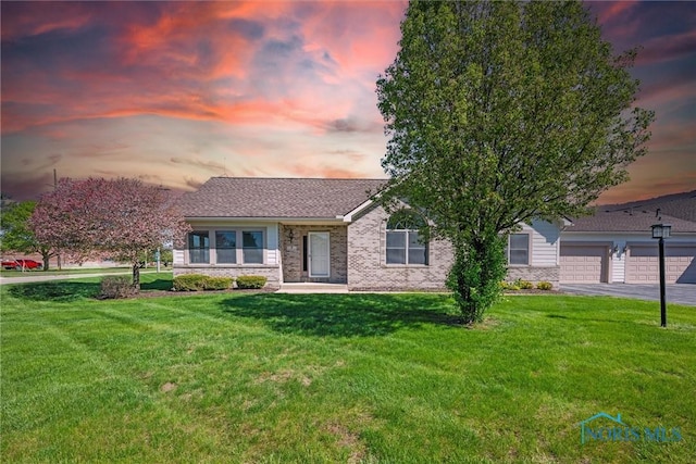 8 Zachary Cir, Waterville, OH 43566 - single story home with brick siding, a yard, and driveway