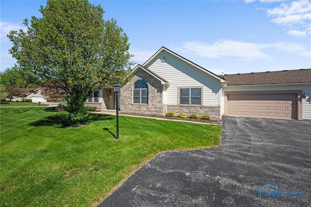 8 Zachary Cir, Waterville, OH 43566 - single story home with brick siding, an attached garage, a front lawn, and aphalt driveway