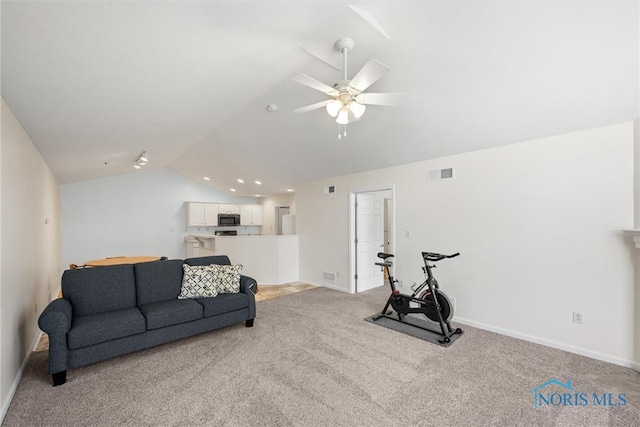 8 Zachary Cir, Waterville, OH 43566 - living room with ceiling fan, visible vents, vaulted ceiling, baseboards, and light carpet