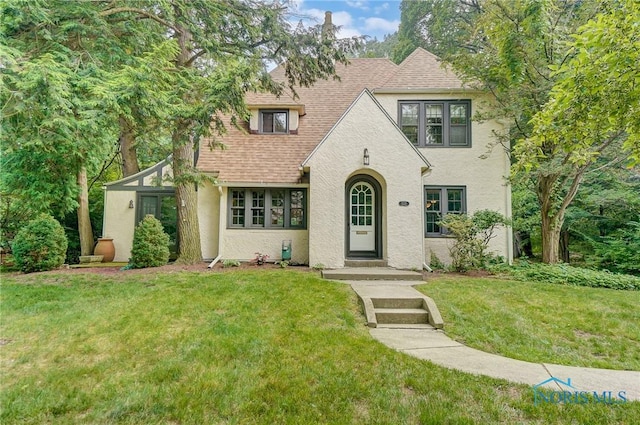 3533 Edgevale Rd, Ottawa Hills, OH 43606 - english style home with stucco siding, roof with shingles, and a front lawn
