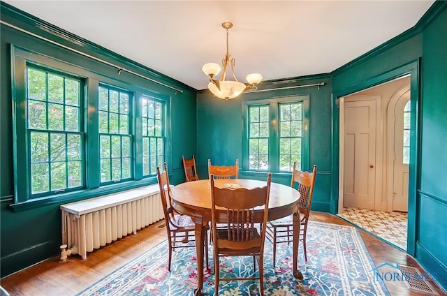 3533 Edgevale Rd, Ottawa Hills, OH 43606 - dining space featuring radiator heating unit, a chandelier, plenty of natural light, and ornamental molding