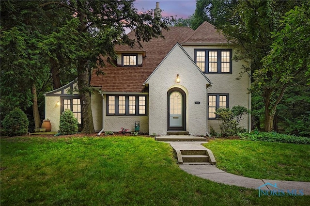3533 Edgevale Rd, Ottawa Hills, OH 43606 - tudor house with a lawn, stucco siding, and roof with shingles