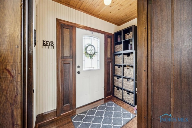 1805 Heatherdowns Blvd, Toledo, OH 43614 - foyer entrance featuring dark wood finished floors, wooden ceiling, wood walls, and crown molding