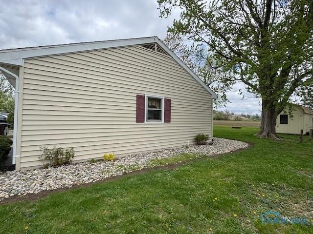 view of home's exterior featuring a lawn