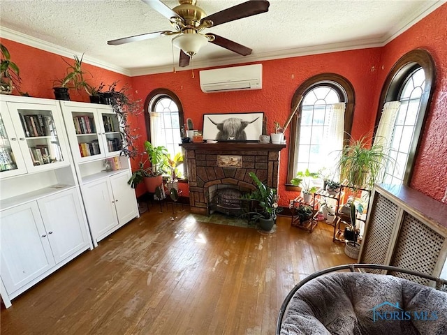 399 Melmore St, Tiffin, OH 44883 - interior space with a wall unit AC, a textured ceiling, wood-type flooring, and a textured wall