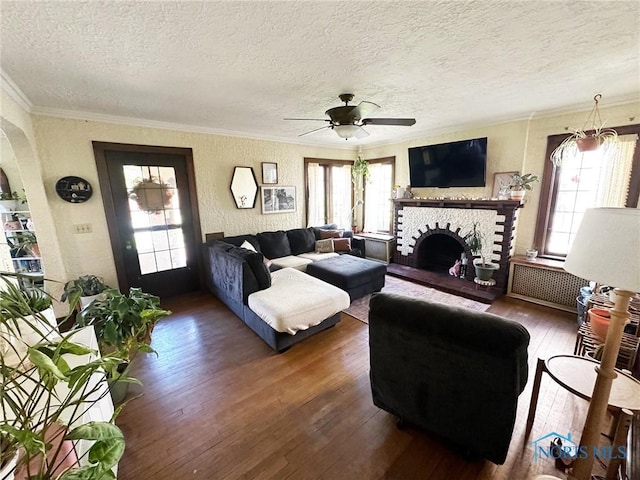 399 Melmore St, Tiffin, OH 44883 - living room featuring a healthy amount of sunlight, hardwood / wood-style flooring, and crown molding