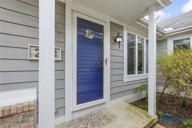 doorway to property featuring a porch