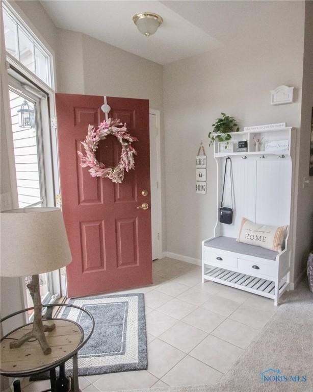 mudroom with light tile patterned flooring