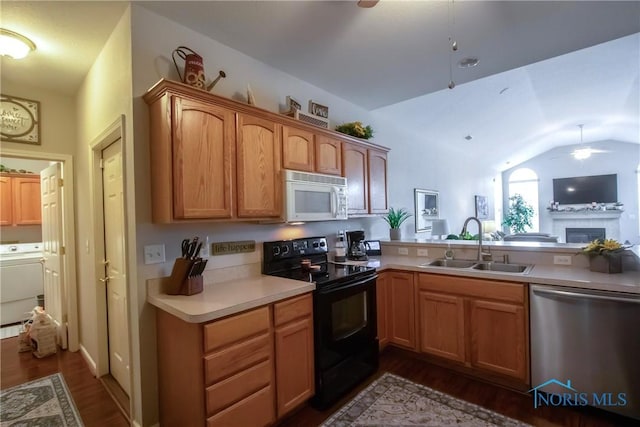 kitchen featuring a sink, black electric range, washer / clothes dryer, white microwave, and stainless steel dishwasher