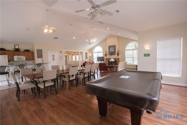 rec room with ceiling fan, pool table, a fireplace, recessed lighting, and light wood-style flooring