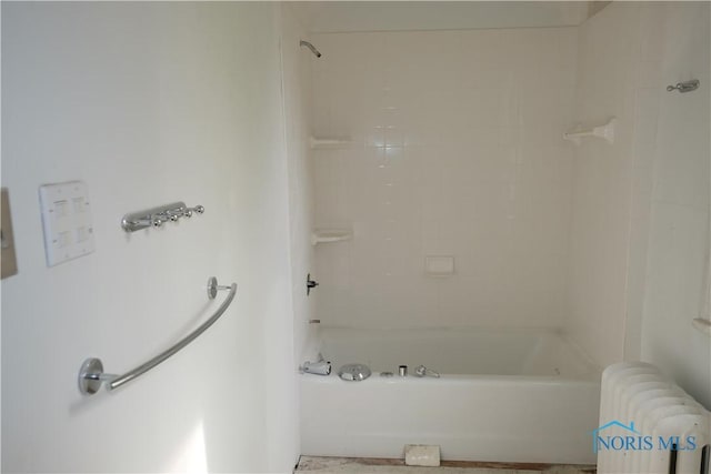 bathroom featuring radiator and shower / washtub combination