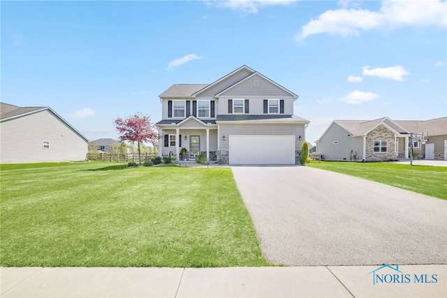 view of front facade featuring concrete driveway, a front lawn, stone siding, and a garage