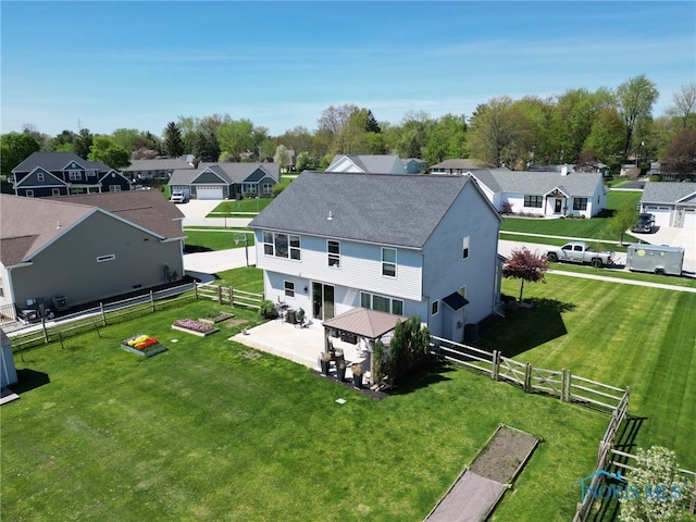 birds eye view of property with a residential view