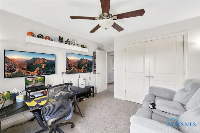 office area with ceiling fan, light carpet, and visible vents
