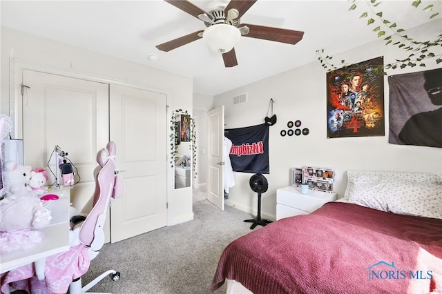 bedroom featuring visible vents, a closet, baseboards, a ceiling fan, and carpet