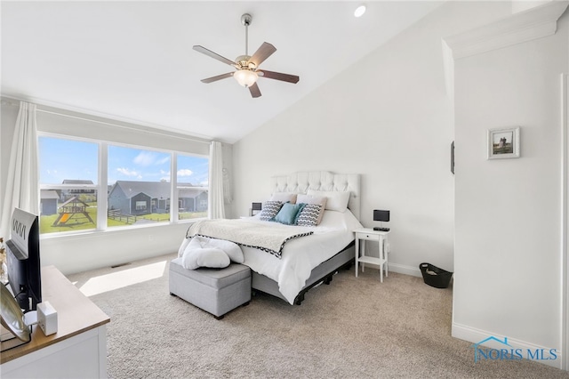 carpeted bedroom with baseboards, ceiling fan, and lofted ceiling